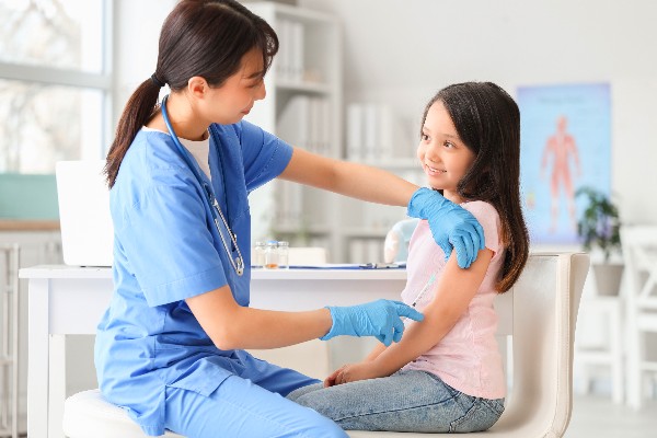 Child-getting-vaccination-in-medical-clinic