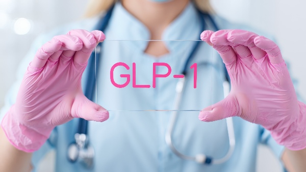Gloved-medical-hands-holding-GLP-1-sign