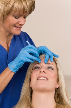 Healthcare-provider-using-Botox-for-migraine-on-patient