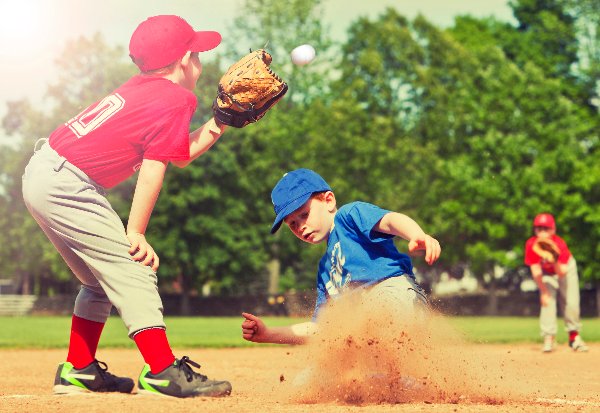 Little-League-baseball-player-sliding-into-base
