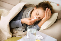 girl with flu on bed