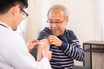 older man getting vaccine