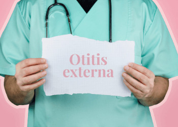 Doctor holding note showing Otitis Externa